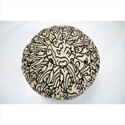 Handcrafted Black and Beige Pouf with Intricate Patterns